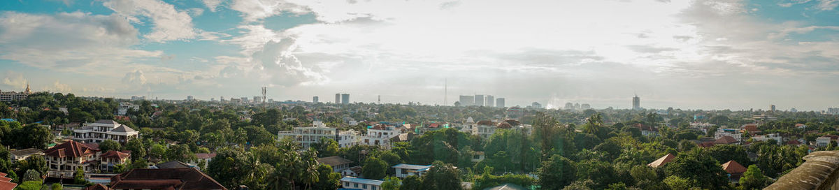 High angle view of city buildings against sky