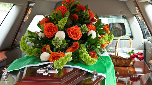 Closeup shot of a funeral casket in a hearse or chapel or burial at cemetery