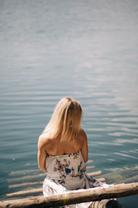 Rear view of woman looking at lake