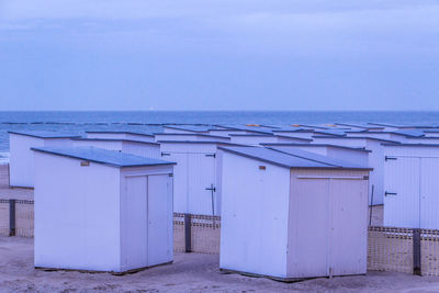 Built structure on beach against clear blue sky