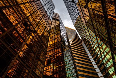 Low angle view of modern buildings against sky