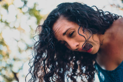 Close-up of young woman looking away