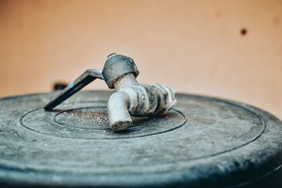 Close-up of tap on plastic container