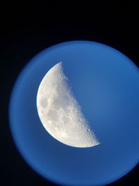 Close-up of moon against blue sky