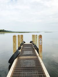 Pier over sea against sky