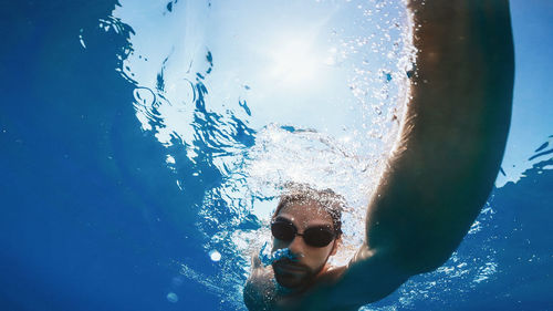 Freestyle swim in the ocean. underwater view