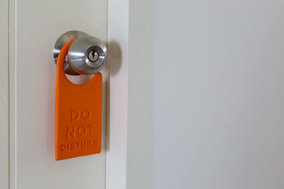 Close-up of text on door handle 