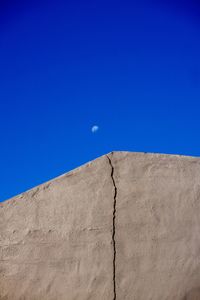 Low angle view of building against clear blue sky