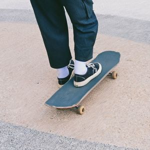 Low section of person standing on skateboard