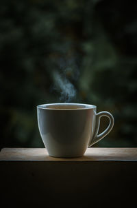 Close-up of coffee cup on table