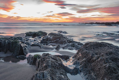 Scenic view of sea against sky at sunset