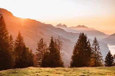 Scenic view of mountains against sky during sunset
