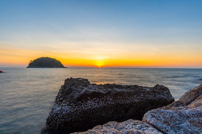 Scenic view of sea against sky during sunset