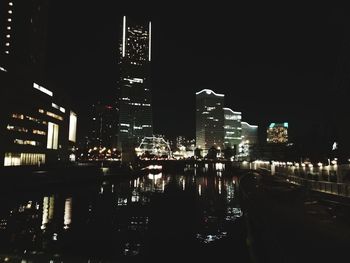 Illuminated modern buildings in city at night