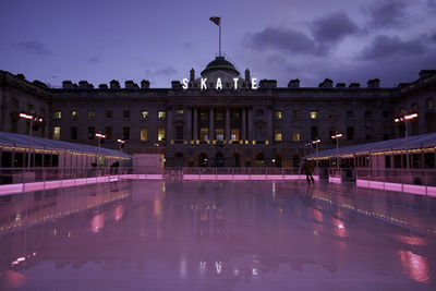 Reflection of building in water at night
