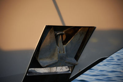 Close-up of sailboat in sea against sky during sunset