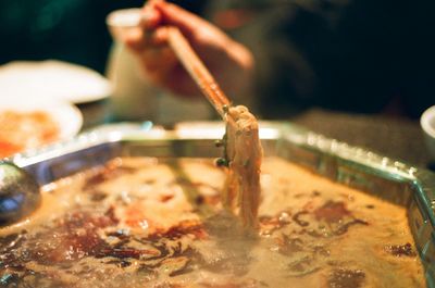 Close-up of person preparing food