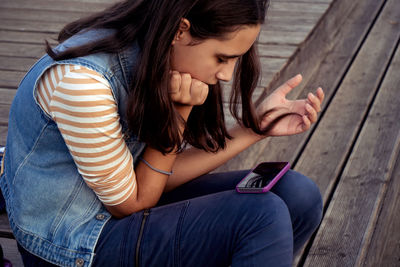 Young woman using mobile phone