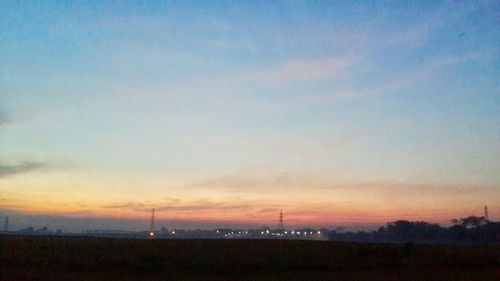 Scenic view of landscape at sunset