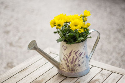 Close-up of yellow flowers on table