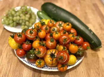 High angle view of tomatoes in plate on table