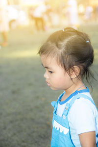 Cute girl standing on land