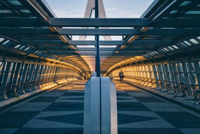 Full length of man walking on bridge