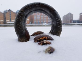 Close-up of snow covered metal during winter