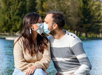 Young couple kissing in water