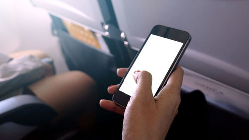 Close-up of man using mobile phone