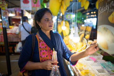 Woman standing at market