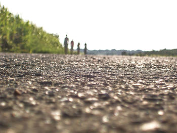 Surface level of ground against clear sky