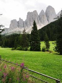 Scenic view of land and mountains against sky