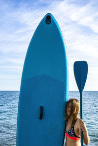 Teenager girl with puddle board. sup