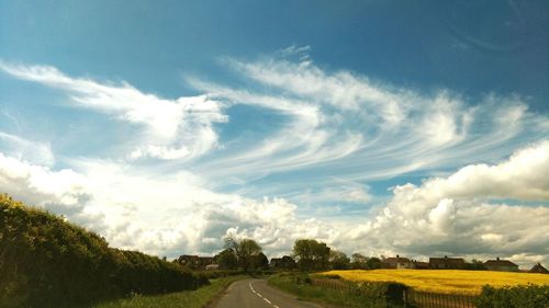 Country road passing through landscape