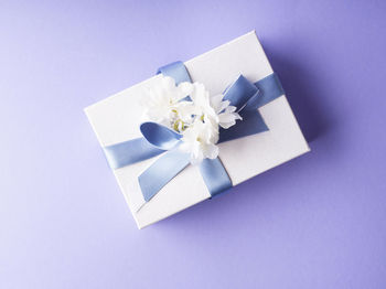 Close-up of gift box on blue background