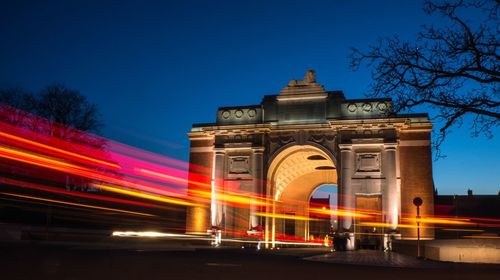 Low angle view of light trails at night