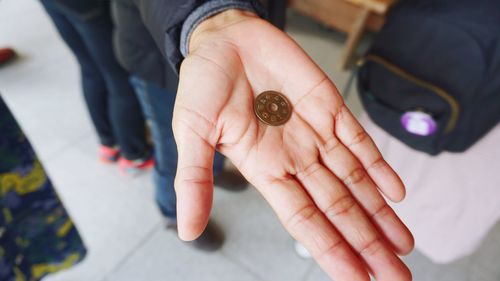 Low section of man showing coin