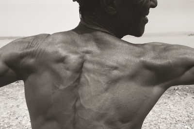 Rear view of shirtless man