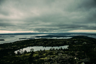 Scenic view of sea against cloudy sky