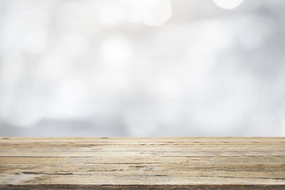 Close-up of wooden plank against sky