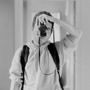 Portrait of person wearing mask standing at home