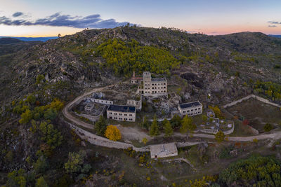 Drone aerial panorama of termas radium hotel serra da pena at sunset in sortelha, portugal