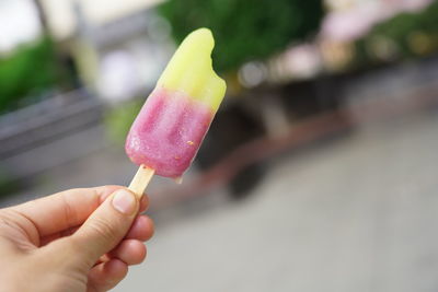 Cropped hand holding ice cream