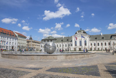 Buildings in city against sky