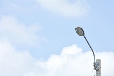 Low angle view of street light against sky