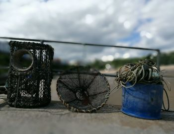 Close-up of rope tied up against sky