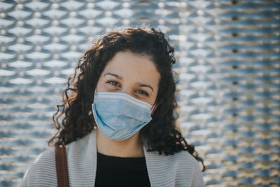 Portrait of a beautiful young woman with mask