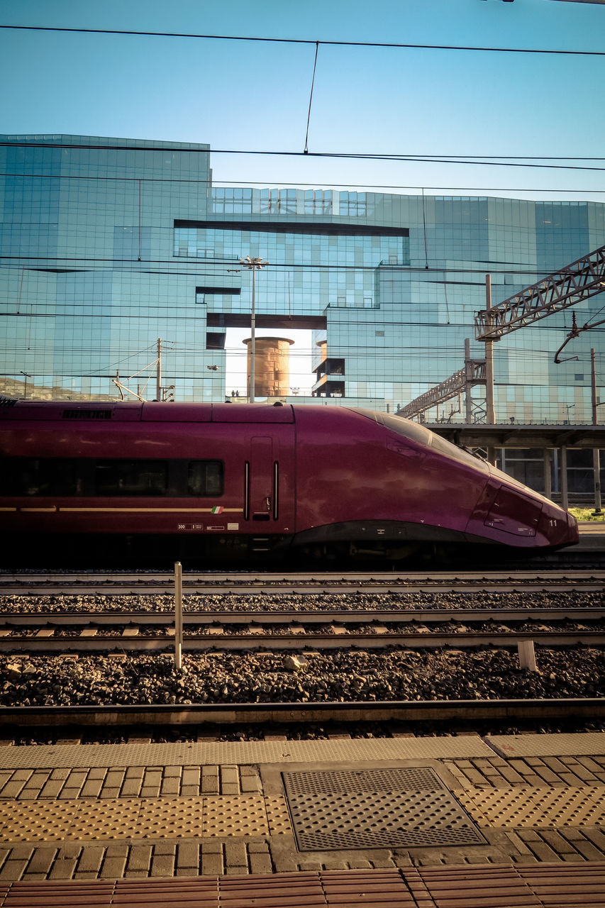 TRAIN AT RAILROAD STATION PLATFORM