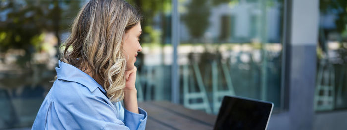 Young woman using mobile phone